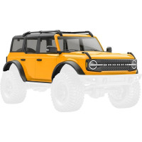 Traxxas Ford Bronco Cyber Orange karosszéria RC modell autóhoz TRX-4M. 1:18 méretarányú ABS karosszéria, komplett, beleértve az átlátszó ablakokat, a pótkerék műpótkereket, a sárvédők szegélyeit, az oldalsó tükröket és egyéb részleteket.