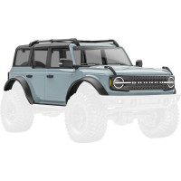 Traxxas Ford Bronco Cactus szürke karosszéria RC modell autóhoz TRX-4M. 1:18 méretarányú ABS karosszéria, komplett, beleértve az átlátszó ablakokat, a pótkerék műpótkereket, a sárvédők szegélyeit, az oldalsó tükröket és egyéb részleteket.
