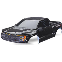 Karosszéria Traxxas Ford F-150 Raptor R fekete, komplett. Beleértve a hűtőrácsot, a hátsó csomagtartó panelt, az oldalsó tükröket, az ablakmaszkot és a matrica lapot. A Traxxas TRA10124 és TRA10125 klipsz nélküli rögzítő rendszerekre történő felszereléshez tervezték. Nem a Slash modellekhez készült.
