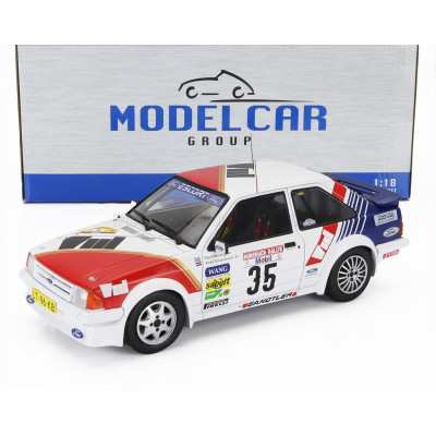 MCG FORD ENGLAND ESCORT MKIII RS TURBO N 35 RALLY HUNSRUCK 1985 STIG ANDERVANG - ANDRE SCHOONENWOLF - WHITE RED BLUE 1/18