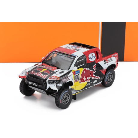 IXO MODELS TOYOTA HILUX GR DKR EVO T1+ PICK-UP TEAM TOYOTA GAZOO RACING RED BULL N 200 WINNER RALLY DAKAR 2023 NASSER AL-ATTIYAH